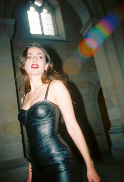A Queen Dressed In A Tight Leather Dress. She Is Inside An A...