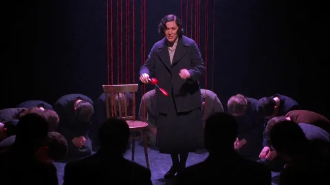 Chcg2002, A Central Figure In A Dark Coat And Skirt Stands O... — Stable Diffusion AI Prompt: chcg2002, A central figure in a dark coat and skirt stands on a dimly lit stage,...