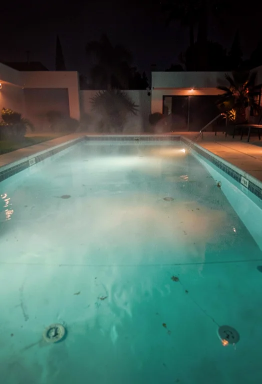 A Swimming Pool Lit Turquoise After Dark, Misty Light, Sharp...