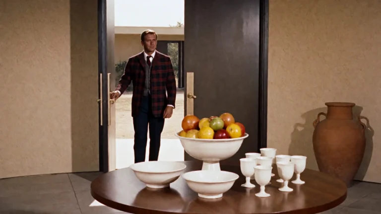 Tmmchn1960, A Man In A Plaid Jacket And Dark Trousers Steps...