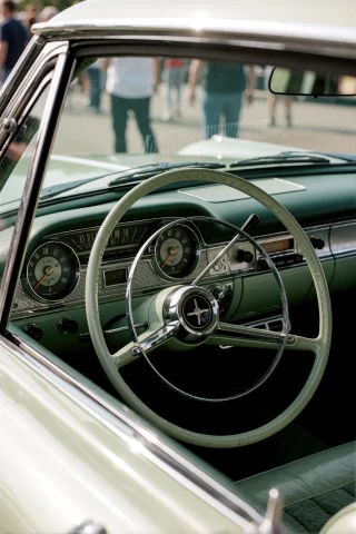 Interior View Of A Vintage Light Green Car, Focusing On The... — Stable Diffusion AI Prompt: Interior view of a vintage light green car, focusing on the driver’s side. A cla...