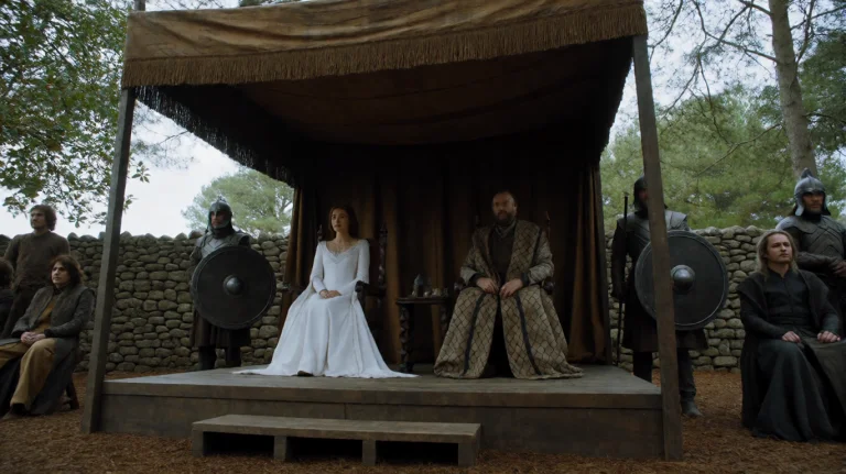Gmthrnsssn5, A Regal Figure In A White Gown Sits Beside A Ma...