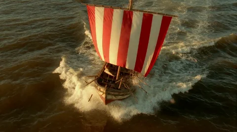 Astrxandob2002, A Small, Weathered Boat With A Red-and-white... — Stable Diffusion AI Prompt: astrxandob2002, A small, weathered boat with a red-and-white striped sail is cau...