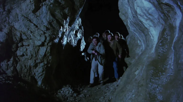 Eghtlggdfr2002, A Group Of People Cautiously Navigates A Nar...