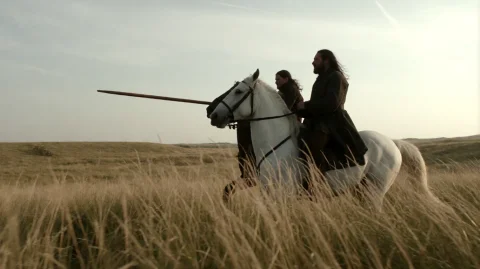 Gmthrnsssn1, A Man With Long Dark Hair And A Beard Rides A W... — Stable Diffusion AI Prompt: gmthrnsssn1, A man with long dark hair and a beard rides a white horse through t...