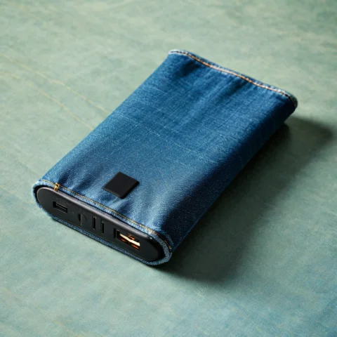 Loratech2denimfabricv10.80, Techdenim, A Portable Power Bank... — SDXL AI Prompt: , techdenim, a portable power bank on a folded blue denim fabric surface, soft n...
