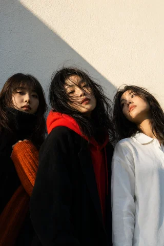 Highleveldescriptioncinematic Low-angle Portrait Of Three Yo... — Stable Diffusion AI Prompt: {"high_level_description":"Cinematic low-angle portrait of three young East Asia...