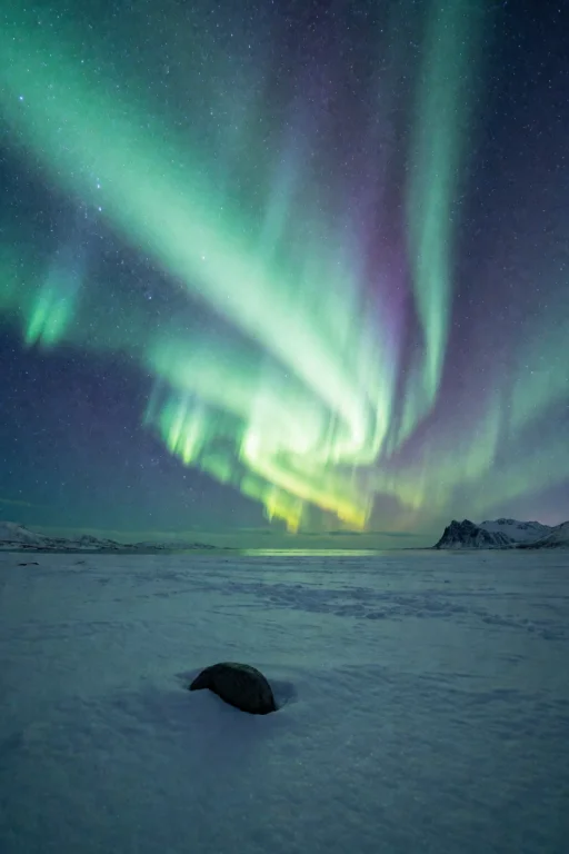 A Vast Flat Snowy Plain At Night Under A Spectacular Green A...