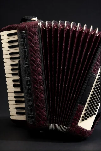 3dworld , An Accordion With Bellows Of Deep Burgundy Ribbed... — Stable Diffusion AI Prompt: 3DWorld , an accordion with bellows of deep burgundy ribbed tattooed leather, ke...