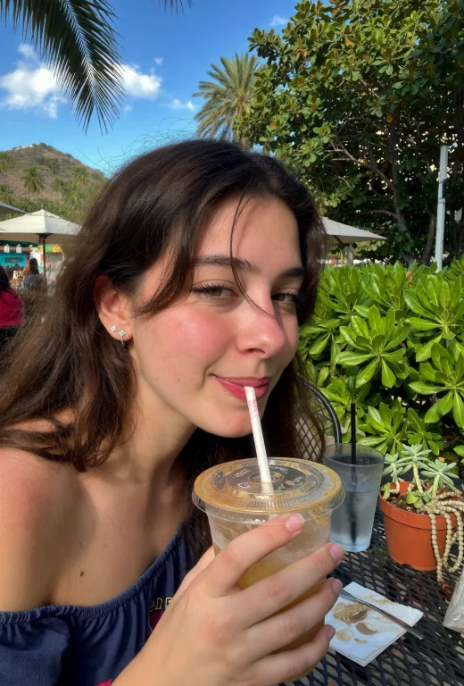 A Content And Carefree Young Woman Enjoys A Moment Of Pure R...