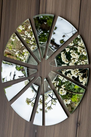 A Shattered Mirror On The Floor, Each Shard Reflecting A Dif... — Stable Diffusion AI Prompt: A shattered mirror on the floor, each shard reflecting a different season of the...