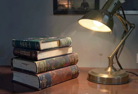 A Stack Of Hardback Books Beside A Reading Lamp, Concept Art... — Stable Diffusion AI Prompt: a stack of hardback books beside a reading lamp, concept art, highly detailed
