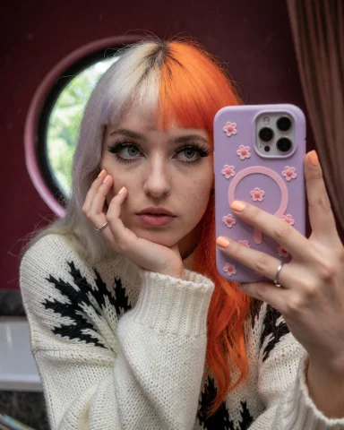 This Photograph Captures A Young Woman Taking A Selfie In A... — Stable Diffusion AI Prompt: This photograph captures a young woman taking a selfie in a bathroom. She has a...