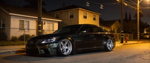 Dynamic 34 Side Angle Wide-shot Of A Parked, Stanced 2011 Le... — Stable Diffusion AI Prompt: Dynamic 3/4 side angle wide-shot of a parked, stanced 2011 Lexus LS. The car occ...