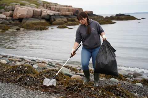Mollychen, Wearing A Faded Hoodie, Jeans, Rubber Boots And W... — Stable Diffusion AI Prompt: mollychen, wearing a faded hoodie, jeans, rubber boots and work gloves, walking...