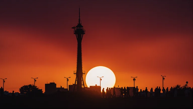 A Dramatic Sunset Scene With A Massive, Brilliant White-oran...