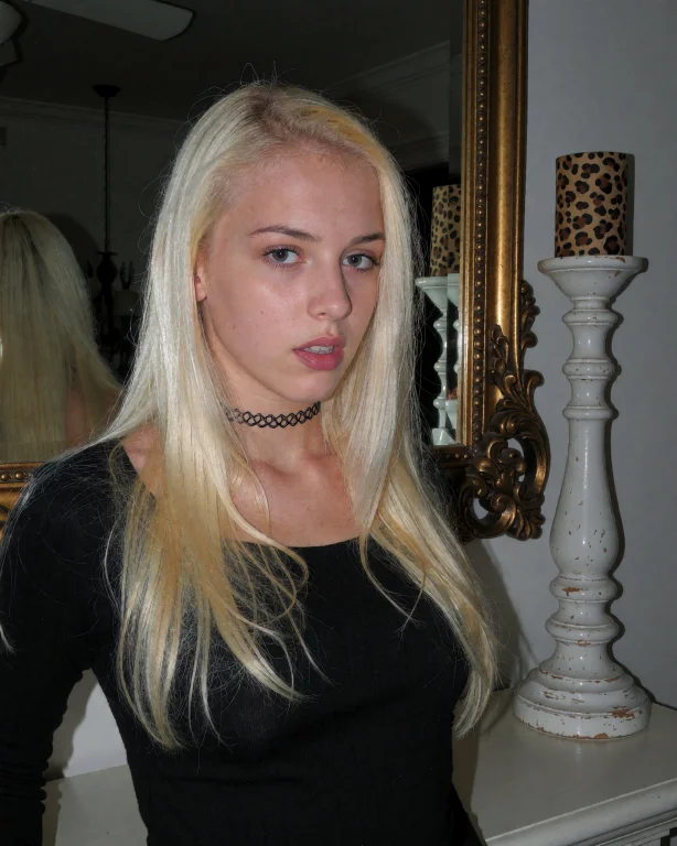 This Photograph Features A Blonde Young Woman With Long, Str...