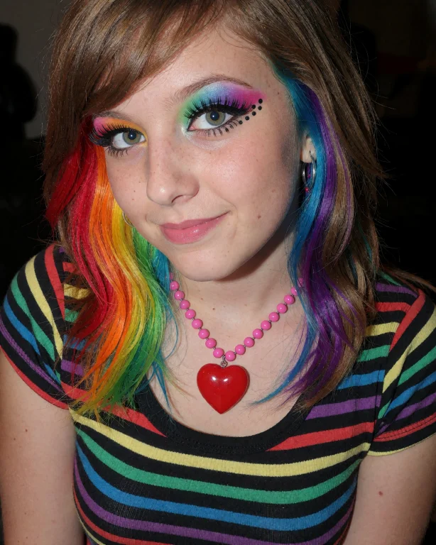 This Is A Photograph Of A Young Woman With A Vibrant, Rainbo...