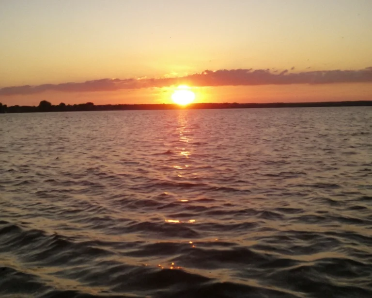 A Photo Of A Sunset Over Water Loraamateurv12