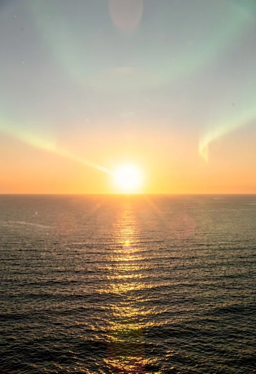 The Sun Rising Over A Calm And Empty Ocean, Documentary Phot...