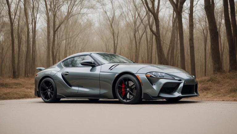 A Toyota Supra Parked In A Road With Trees, Winter Season, E...