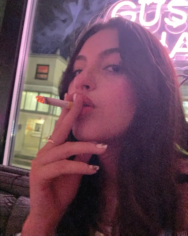 Candidsnap, A Close-up Phone Photo Of A Young Woman Holding...