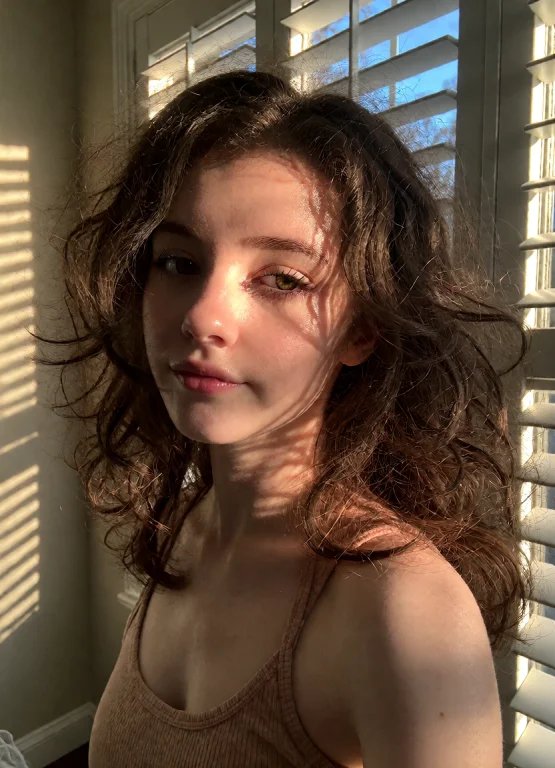 A Beautiful 22-year-old Woman With Voluminous, Tightly Curle...