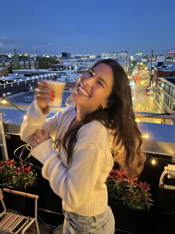 Candidsnap, A Young Woman Laughs On A Rooftop Terrace At Dus...