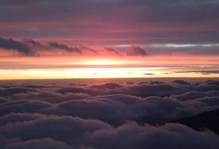 A Photograph Of A Beautiful Evening Sunset Above The Clouds