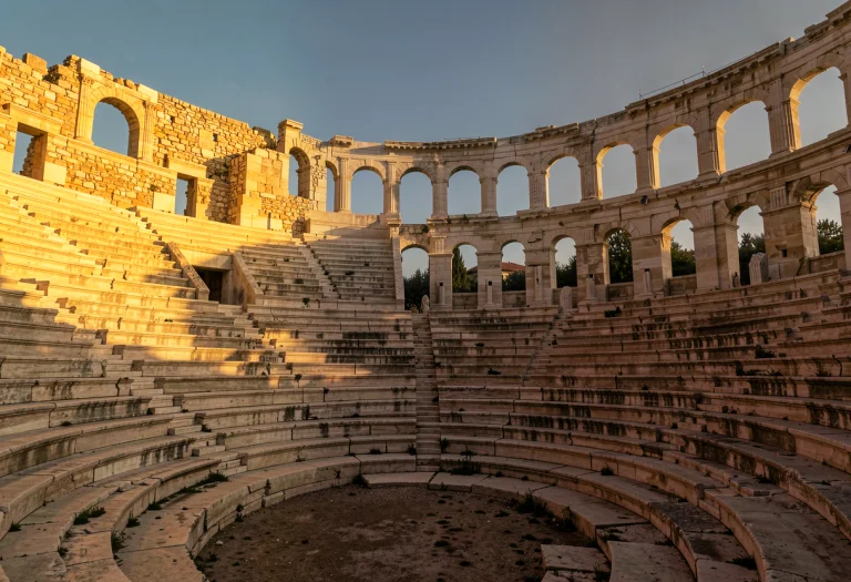 An Ancient Greek Amphitheater At Golden Hour, Low Key Lighti...