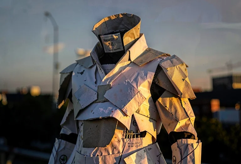 An Avant-garde Outfit Built From Folded Paper, Dramatic Chia...