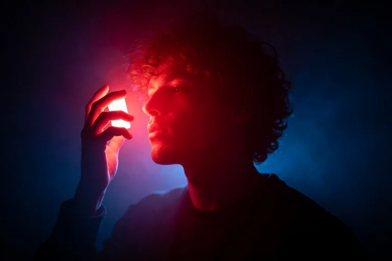 Photograph Of A Silhouette Of A Person With Curly Hair, Hold...