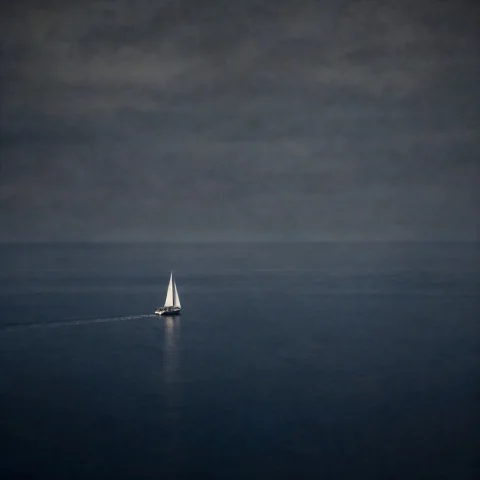 Lorapqwenimage218stepv011.0 A Moody Fine Art Seascape Photog... — Stable Diffusion AI Prompt: A moody fine art seascape photograph dominated by negative space: a tiny lone s...