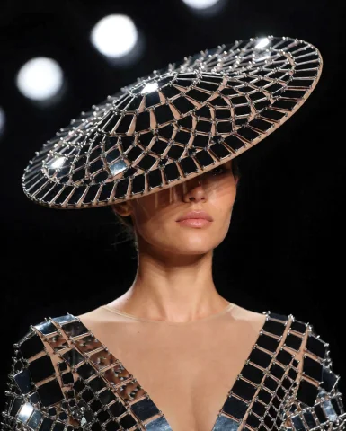Generation Modekrea2txt2img Positive Prompta Catwalk Model W... — Stable Diffusion AI Prompt: Generation Mode:krea2_txt2img Positive Prompt:A catwalk model wears a hat made o...