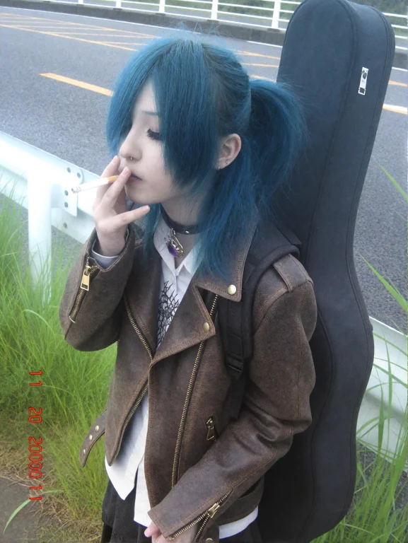 Shot On Nokia With 2000s Aestetics. A Young Person With Blue...