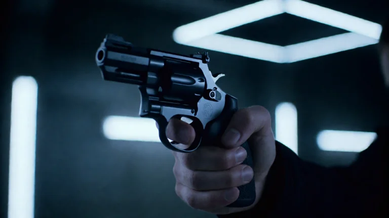 Undrwrldbl2016, A Hand Grips A Revolver, Aiming It Forward W...
