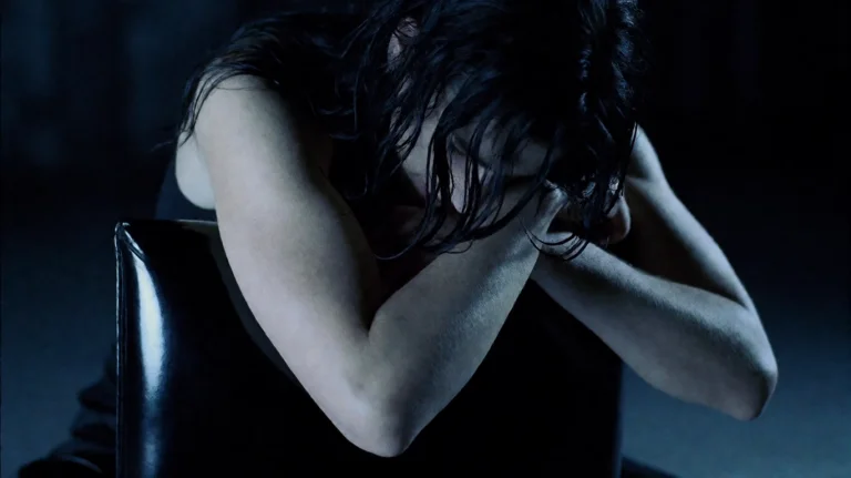 Undrwrld2003, A Person With Long, Dark, Wet Hair Is Hunched...