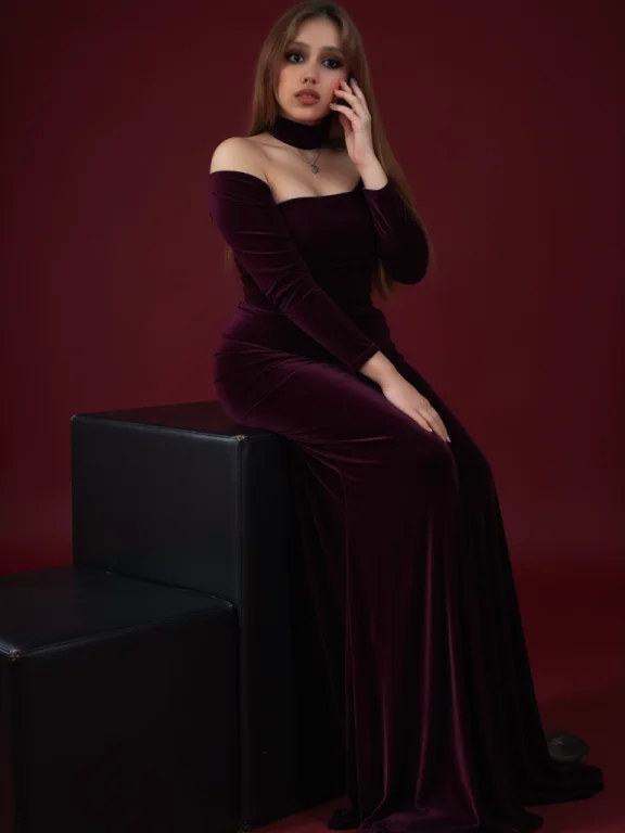 A Woman In A High-collared Velvet Gown, Posed On A Raised Bl...