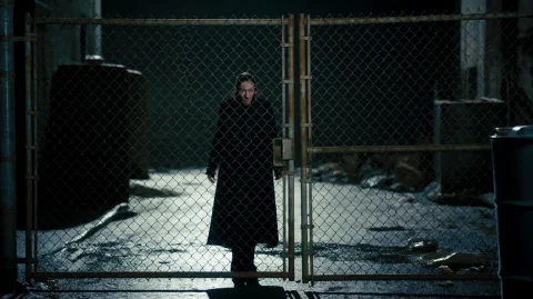 Undrwrldaw2012, A Solitary Figure In A Long, Dark Coat Stand... — Stable Diffusion AI Prompt: undrwrldaw2012, A solitary figure in a long, dark coat stands behind a rusted ch...