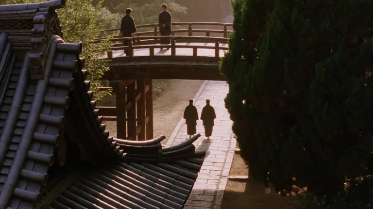 Lstsmr2003, Two Figures In Dark Robes Walk Along A Sunlit St...