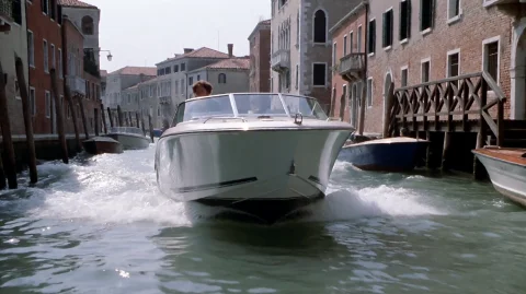 Itlnjb2003, A Sleek, White Motorboat Speeds Through A Narrow... — Stable Diffusion AI Prompt: itlnjb2003, A sleek, white motorboat speeds through a narrow canal, its bow cutt...