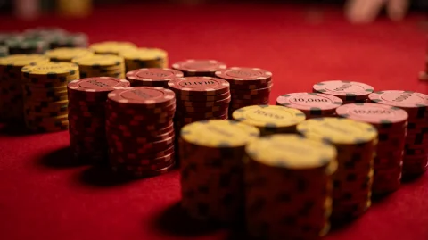 Ocnsthrtn2007, Neatly Stacked Piles Of Poker Chips In Yellow... — Stable Diffusion AI Prompt: ocnsthrtn2007, neatly stacked piles of poker chips in yellow, red, and pink hues...