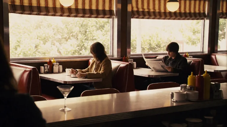 Nxt2007, Inside A Retro-style Diner, A Person In A Tan Jacke...