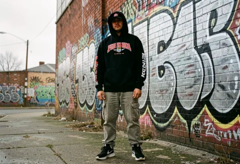 A Bold Streetwear Look Against Graffiti Walls, Photograph, O... — Stable Diffusion AI Prompt: a bold streetwear look against graffiti walls, photograph, overcast light, 35mm...