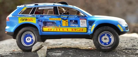 Toy Version Of A Little Blue Rallybot Called Stanley, A Vw T... — SDXL AI Prompt: toy version of a little blue rallybot called Stanley, a VW Touareg in DARPA Gran...