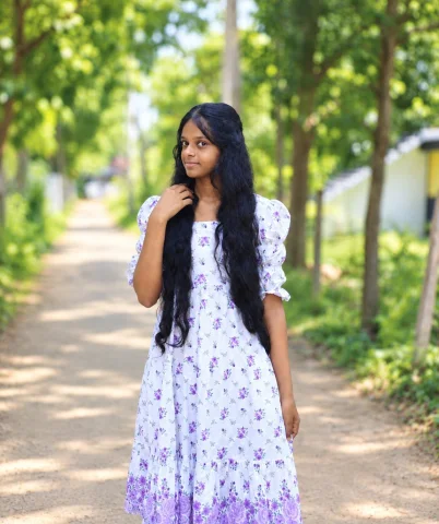Birthday photo 📷 — Google Imagen AI Prompt: 15+year old Sri Lankan girl on Mirissa beach, wearing light pink dress.sitting o...